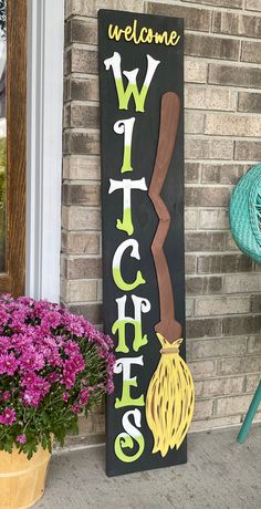 a welcome sign on the side of a house