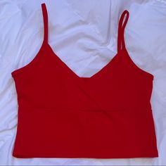 Perfect Condition, Never Worn. Super Cute Surplice Front That’s Very Flattering! Super Trendy Basic Top. Feel Free To Ask Any Questions! “Color: Red Style: Casual Pattern Type: Plain Type: Cami Neckline: Spaghetti Strap Length: Crop Fit Type: Slim Fit Fabric: Slight Stretch Material: Cotton Composition: 95% Cotton, 5% Spandex Care Instructions: Machine Wash Or Professional Dry Clean Chest Pad: No Padding Sheer: No Trendy Red Crop Top With Built-in Bra, Red Seamless Crop Top Tank, Chic Red Tank Top With Built-in Bra, Chic Red Cropped Tank Top, Red Tops With Built-in Bra For Spring, Red Crop Top With Built-in Bra For Night Out, Red Seamless Cami Top, Red Tops With Built-in Bra For Night Out, Red Top With Built-in Bra For Night Out