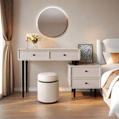 a bedroom with white furniture and a round mirror on the wall