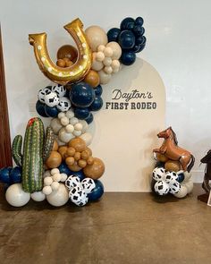 some balloons are arranged in the shape of letters and animals on top of each other