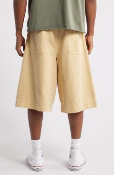 Relaxed and very roomy, these shorts cut from soft cotton twill hit well below the knee and slouch like they're your most comfortable old favorites. Exclusive retailer 13 1/2" inseam; 32" leg opening; 15" front rise; 19" back rise (size 32) Zip fly with button closure Front slant pockets; back patch pockets 100% cotton Machine wash, tumble dry Imported Casual Bermuda Cotton Pants, Casual Cotton Bermuda Bottoms, Casual Bermuda Cotton Bottoms, Cotton Cargo Shorts With Elastic Waistband For Spring, Beige Cotton Cargo Shorts For Spring, Spring Cotton Cargo Shorts With Elastic Waistband, Casual Bermuda Cargo Shorts For Spring, Cotton Wide Leg Pants With Built-in Shorts, Cotton Wide Leg Shorts With Elastic Waistband