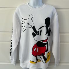 Available In Two Size Medium And Large 60% Cotton 40% Polyester Disney Sweatshirt Mickey Mouse Casual Mickey Mouse Crew Neck Sweatshirt, Sporty Mickey Mouse Crew Neck Top, White Disney Cotton Sweatshirt, Casual Crew Neck Mickey Mouse Sweatshirt, White Mickey Mouse Crew Neck T-shirt, Casual White Mickey Mouse Sweatshirt, White Cotton Mickey Mouse Sweatshirt, Casual White Sweatshirt With Cartoon Print, White Disney Crew Neck Sweatshirt