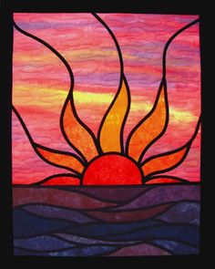 a stained glass window with the sun rising over water