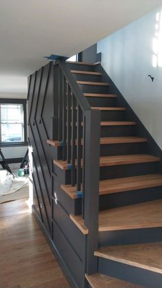 a stair case in the middle of a living room