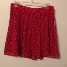 New With Tags - Red With Flower Design - Full Red Slip Underneath- Size Small Petite- Elastic Waist Band In Back- Measures 17 Inches From Top To Bottom Red Skirted Bottoms For Spring, Red Pleated Summer Bottoms, Red Pleated Bottoms For Summer, Spring Red Floral Print Bottoms, Red Floral Print Spring Bottoms, Red Floral Print Bottoms For Spring, Short Red Summer Skirt, Red Floral Print Short Length Bottoms, Red Casual Skirt With Floral Print