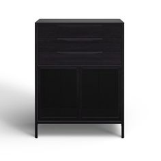 a black cabinet sitting on top of a white floor