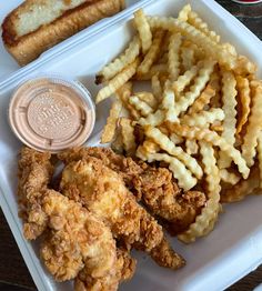 fried chicken and french fries on a white plate