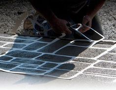 a man is working on a tile floor