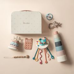 the contents of a baby's gift box laid out on top of a table