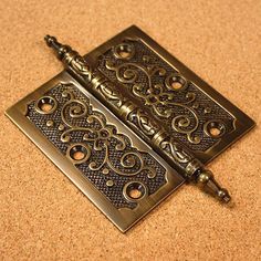 two metal trays with ornate designs on them