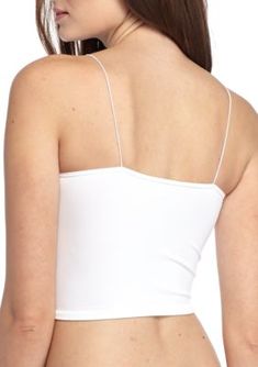 American made from Free People's Signature Seamless fabric, this stretchy brami features elastic straps and a ribbed hem. | Free People Women's Skinny Strap Brami, White, M/L White Bra Friendly Elastane Top, Seamless Elastane Crop Top With Tank Straps, Stretch Strap Crop Top, Stretch Crop Top With Straps, Stretch Elastane Cami Crop Top, Stretch Elastane Tops With Straps, Stretch Straps Crop Top, Stretch Elastane Crop Top With Spaghetti Straps, Stretch Elastane Crop Top Camisole