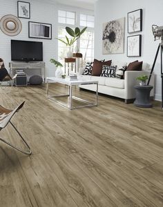 a living room with wood flooring and white walls