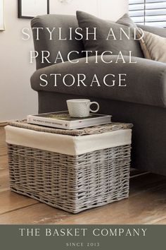 a basket sitting on top of a wooden floor next to a gray couch with the words stylish and practical storage above it