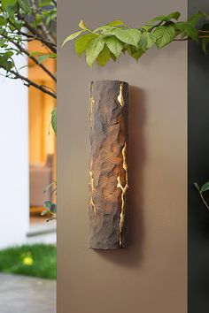 three different types of wall sconces with plants growing on them and in the background