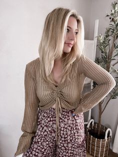 Our Beach Time Crochet Top features an open knit brown hued material, crop style fit with a adjustablele tie bust, and long flowy sleeves. Model is 5'1", 34D, 6/28 and is wearing a size medium. Item runs true to size. More details: 100% polyester. hand wash or wash on cold and hang to dry. Chic Crop Top For Vacation In Fall, Chic Crop Top For Fall Vacation, Bohemian Crop Top For Fall, Knit Crop Top For Day Out In Fall, Cropped Crop Top For Fall Vacation, Fall Bohemian Crop Top, Chic Brown Crop Top For Fall, Brown Long Sleeve Crop Top For Summer, Spring Brown Cropped Sweater