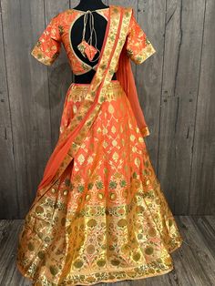 Gorgeous peach and gold Banarsi Lehenga set.  Includes * kalidar lehenga finely stitched with lining and finished with latkans. *  designer padded blouse, with extra stitches to go up a couple sizes. * chiffon dupatta with Banarsi border. Designer Orange Anarkali Set With Pallu Detail, Designer Orange Anarkali Set With Pallu, Festive Orange Anarkali Set With Pallu, Festive Orange Sharara With Pallu, Orange Anarkali Banarasi Silk Choli, Anarkali Orange Banarasi Silk Choli, Orange Anarkali Set With Pallu For Diwali, Diwali Orange Anarkali Set With Pallu, Designer Orange Art Silk Sharara