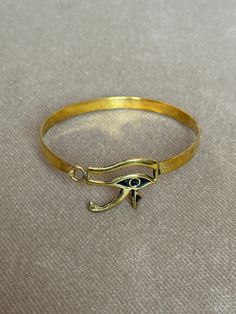 If You Can't Stop Thinking About ItBUY IT ;) Eye of Horus, in ancient Egypt, a symbol representing protection, health, and restoration. According to Egyptian myth, Horus lost his left eye in a struggle with Seth. The eye was magically restored by Hathor, and this restoration came to symbolize the process of making whole and healing. For this reason, the symbol was often used in amulets. Visit https://www.etsy.com/shop/egyptoriginals  for more handcrafted Ancient Egyptian Art Sculpture statues Symbolic Brass Bracelet Jewelry, Symbolic Bronze Ceremonial Jewelry, Ceremonial Symbolic Bronze Jewelry, Bronze Symbolic Bangle Jewelry, Symbolic Bronze Bangle Jewelry, Symbolic Metal Bracelets, Symbolic Round Metal Bracelet, Symbolic Bracelet Jewelry As Gift, Symbolic Adjustable Round Bracelets