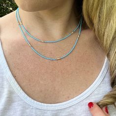 Dainty Layered Beaded Necklace with Blue and Beige/White Czech Glass Beads. Super Lightweight! Beads: * Blue Czech Glass - 1mm * Beige Seed Beads - 2mm * 10K Gold Spacer Beads - 2mm Clasp: *10K Gold Plated Lobster Claw Clasp  * The model in the pictures is wearing 16 & 18 inches.  Choose your Lengths at Checkout! If you don't see a certain length in the drop down menu, please message me with the lengths you would like :)  To view more of my original jewelry designs, visit: https://www.etsy.com/s Sead Bead Necklace, Layered Beaded Necklace, Beachy Necklace, Layered Beaded Necklaces, Original Jewelry Design, Beach Necklace, Necklace Layered, Beach Necklaces, Bohemian Necklace