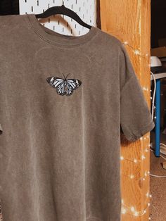 "Embroidered Butterfly T-shirt! -Embroidered on 100% Cotton, Comfort Colors Brand T-shirts. This design is simple and minimalistic, perfect for every outfit! -Embroidery design measures 4.3\" x 2.8\" for sizes S-XL. Embroidery design measures 5.1\" x 3.2\" for sizes 2X-3X. -See product pictures for shirt sizing chart. -All t-shirt designs are handmade on an embroidery machine so there may be slight differences, but we only sell the shirts that meet our high-quality standards. -To maintain the qu Casual Crew Neck T-shirt With Custom Embroidery, Casual Tops With Custom Embroidery And Relaxed Fit, Casual Tops With Custom Embroidery In Relaxed Fit, Trendy Cotton T-shirt With Custom Embroidery, Cotton T-shirt With Custom Embroidery For Streetwear, Basic Cotton Tops With Custom Embroidery And Relaxed Fit, Trendy Custom Embroidery Tops For Streetwear, Basic Relaxed Fit Top With Custom Embroidery, Casual T-shirt With Custom Embroidery For Everyday