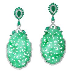 These stunning hand carved Jade earrings are thoughtfully and meticulously crafted in 18-karat gold. It is set in 32.66 carats Jade, 2.68 carats emerald and 1.12 carats of diamonds. FOLLOW MEGHNA JEWELS storefront to view the latest collection & exclusive pieces. Meghna Jewels is proudly rated as a Top Seller on 1stDibs with 5 star customer reviews. All items manufactured by us are handmade and can be customized or redesigned. Composition Size-63X27 MM Total Weight-20.446 Gold Weight(Gms)-13.154 Luxury Carved Earrings, Luxury Carved Earrings For Formal Occasions, Elegant Carved Earrings For Formal Occasions, Luxury Earrings With Intricate Design, Elegant Carved Drop Earrings, Elegant Carved Round Earrings, Elegant Round Carved Earrings, Luxury Green Bridal Earrings, Jadeite Jewelry