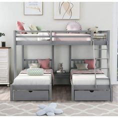 two bunk beds sitting next to each other on top of a carpeted floor in front of a white wall