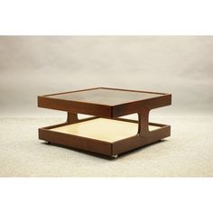 a square coffee table with an open drawer on the bottom and one shelf below it