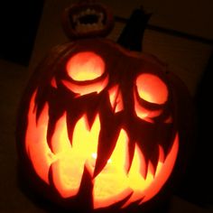 a carved pumpkin sitting on top of a table