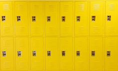 yellow lockers are lined up against the wall