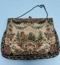 Not often does one see such a fine little tapestry handbag. Pictured is a castle, with trees and roses comprising the border. It measures about 6" high X 7" across. The lining is peach colored silk and shows that at some time the chain handle was stored inside, as there a bit of residue as a result. Please refer to photo #3. Inside is a tiny remnant of a manufactures tag which I cannot read. Also please refer to the area around the castle..since the same appears on both sides, I think it's shado Vintage Tapestry Pouch Bag, Antique Tapestry Bags For Everyday, Vintage Tapestry Handmade Bags, Vintage Handmade Tapestry Bag, Vintage Embroidered Tapestry Shoulder Bag, Vintage Tapestry Multicolor Shoulder Bag, Antique Multicolor Rectangular Bag, Victorian Style Rectangular Tapestry Bag, Antique Multicolor Rectangular Bags