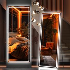 two mirrors that are next to each other in front of a bed with lights on it