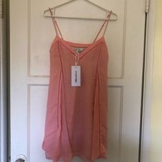 Nice Salmon Color. Size Xs 100% Silk. I Bought It For A Birthday Party But Never Wore It. I’m 5’4 And It Hits Me Mid Thigh. Spring Mini Length Lined Slip Dress, Casual Lined Slip Dress For Spring, Spring V-neck Lined Slip Dress, Lined V-neck Slip Dress For Spring, Trendy Spring Slip Dress, Flirty Midi Slip Dress For Spring, Lined Slip Dress For Summer Brunch, Summer Lined Slip Dress For Brunch, Spring Party Slip Dress In Flirty Style