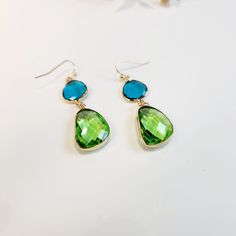 Step into summer with these pretty Blue and Green Olivestone Dangle Drop Pendant Earrings! Perfect for adding a touch of glam to any outfit, these earrings are designed to be both stylish and different, ensuring you stand out with their unique, colourful charm. Visit the Jazzi J shop for more items - https://jazzijbykaren.etsy.com Key Features: * Pretty Design: The beautiful combination of blue and green olivestones creates a captivating look that is perfect for any occasion. * Glamorous Appeal: Green Teardrop Jewelry For Summer, Trendy Blue Teardrop Earrings Gift, Trendy Blue Teardrop Earrings For Gift, Trendy Blue Teardrop Earrings For Gifting, Blue Teardrop Earrings For Summer Gift, Summer Blue Teardrop Earrings As Gift, Trendy Green Crystal Earrings For Gift, Elegant Turquoise Earrings For Summer, Summer Crystal Drop Earrings Gift