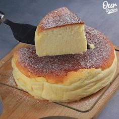 a piece of cake sitting on top of a wooden cutting board