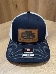 Rev up your style with our classic and work truck-inspired hats, tailor-made for boys and men who eat, sleep, and breathe the rumble of engines and the open road. These hats, adorned with rugged leather-like patches, aren't just accessories; they're a salute to the timeless love affair between men and their trucks. Wear these hats with pride, for they are more than just a fashion statement; they are a tribute to the enduring love affair between a man and his truck. May your adventures be as lege Father's Day Trucker Baseball Cap With Curved Brim, Trucker Hat 5-panel As Gift, Trucker 5-panel Hat As Gift, Trucker Hat As A Gift, Trucker Hat With Flat Brim As Gift, Flat Brim Trucker Hat As Gift, Trucker Baseball Cap With Leather Patch, Brown Trucker Hat For Father's Day, Father's Day Trucker Hat In Baseball Cap Style