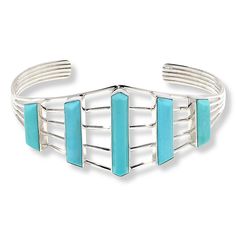 Jay King Gallery Collection Campitos Turquoise Cuff Bracelet  A fun spilt-top design and vertical Campitos turquoise stones bezel-set across top, make this handcrafted sterling silver cuff bracelet an outstanding addition to any accessories collection! From Jay's exclusive Gallery Collection.       Approx. 6-3/4"L x 1-1/16"W; fits 6" to 7" wrist     Stamped .925     Sterling silver cuff bracelet has five-way split top bezel-set with five oblong, vertical turquoise stones     Cuff design tapers to solid arms   Stone Information       All sizes and weights approximate     Stabilized Blue-Green Campitos Turquoise - Freeform (5x27mm, 5x15mm to 5x21mm); mined in Mexico Modern Turquoise Cuff Bangle, Modern Turquoise Cuff Bangle Bracelet, Adjustable Turquoise Modern Cuff Bracelet, Adjustable Turquoise Cuff Bracelet Modern Style, Split Top, Jewelry King, Cuff Design, Turquoise Bracelet Cuff, Color Bands