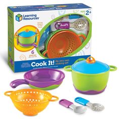 the learning kitchen set includes three pots and two spoons, one with a strainer