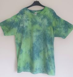 A relaxed, marble designed Tee, with chilled out green colours to embrace the feel-good summer feeling. Design shown is XL Available in a range of T-Shirt, Sweatshirt, Women's Vest, and Bandana options, you can ensure you'll be able to express your style in whichever item you need to complete your outfit. All designs are hand-dyed, and therefore, you can rest easy knowing that you are ordering a truly unique product - as no two are exactly alike! All dyes used are vegan certified and sustainable Crumple Tie Dye, Green Colours, Cut Tees, Tie Dye Outfits, Dark And Light, Tie And Dye, Dye Shirt, Summer Feeling, Tie Dye T Shirts