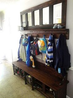 a coat rack with coats hanging on it