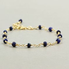 Sapphire Gold Bracelet, Navy Blue Everyday Bracelet, September Birthstone. $42.00, via Etsy. Dainty Blue Bracelets With Faceted Beads, Sapphire Round Faceted Bead Bracelets, Minimalist Blue Jubilee Bracelet, Blue Minimalist Jubilee Bracelet, Dainty Blue Faceted Beaded Bracelets, Blue Sapphire Bracelet, Everyday Bracelet, Sapphire Bracelet, Gold Bracelet Chain