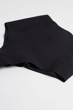 High-waisted French knickers in raw-cut microfiber featuring a double layer at the front for a comfortable sculpting effect. The lack of seams makes them the ideal choice for anyone wishing to keep their underwear invisible under their clothing. Pure cotton inner gusset. Black Seamless Micro-elastic Hosiery, Black Fitted Seamless Bottoms, Fitted Black Bottoms With Seamless Design, High Stretch Soft Touch Black Bottoms, Black High Stretch Soft Touch Bottoms, High Stretch Black Bottoms With Soft Touch, Micro-elastic Black Shapewear In Elastane, Compressive Seamless Elastane Hosiery, Compressive Seamless Hosiery