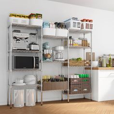 a kitchen with white walls and shelves filled with various foodstuffs, dishes, and appliances