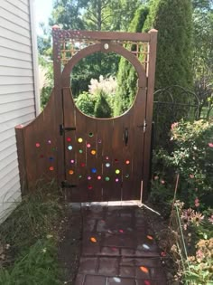 a wooden gate that has confetti on the top and bottom part of it