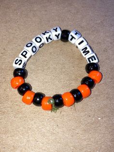 Don't want to leave that spooky/fall season? Show it/embrace it with a handmade beaded bracelet! We also do Custom/personalized beaded bracelets for $7 that are made with plastic beads and stretchy/elastic cord!  Custom orders available in these bead color options: dark red, bright red, orange, yellow, emerald green, forest green, royal blue, sky blue, blue-grey, purple, light pink, dark pink, tan, light brown, dark brown, white, grey, black Halloween Gift Bracelets With Letter Beads, Black Beaded Bracelet For Halloween, Black Beaded Stretch Bracelet For Halloween, Halloween Novelty Beaded Bracelets With Round Beads, Personalized Halloween Beaded Bracelets, Halloween Beaded Bracelets With Letter Beads, Customized Beaded Bracelets For Halloween Gift, Beaded Bracelets For Halloween Gift, Personalized Beaded Bracelets For Halloween