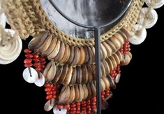 "Another wonderful Papua New Guinea, Sepik River, Ceremonial Necklace. Old Brown Shell crescent on two braided rope bands decorated with Nassa, Cowries, and Conus disks. Three graduated rows of large brown Cowries laden at the bottom decorated with a fringe of red abrus seeds, and circular round shells. These ornaments were worn by both men and women, and were also utilized as currency in bride price exchanges. Wear consistent with age and use. Formerly from an Indonesian Private Collection. Cus Traditional Handwoven Natural Jewelry, Traditional Handwoven Natural Color Jewelry, Red Braided Bohemian Jewelry, Traditional Woven Jewelry In Natural Color, Traditional Woven Natural Jewelry, Traditional Woven Natural Color Jewelry, Traditional Macrame Jewelry For Festivals, Traditional Macrame Necklaces For Festivals, Traditional Decorative Necklaces