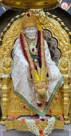 the statue is decorated in gold and red