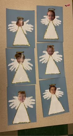 four pictures of an angel with white wings on blue paper and gold glittered edges