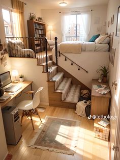 a small bedroom with stairs leading up to the bed and desk in front of it