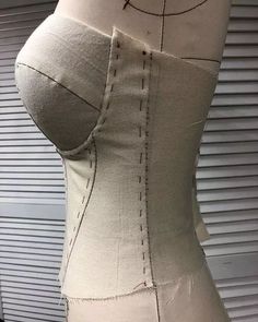 the back of a woman's corset with stitches on it