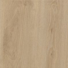 a close up view of the wood grains on this flooring material, which is light brown in color