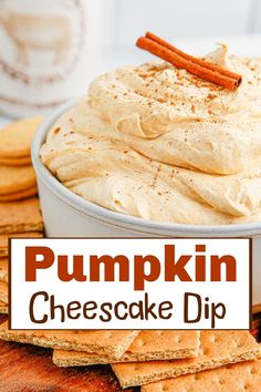 pumpkin cheesecake dip in a white bowl surrounded by crackers